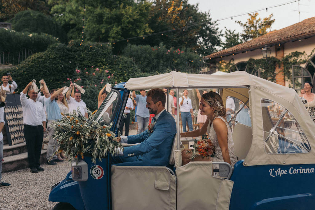 Bride and Groom in Italian Car At Wedding